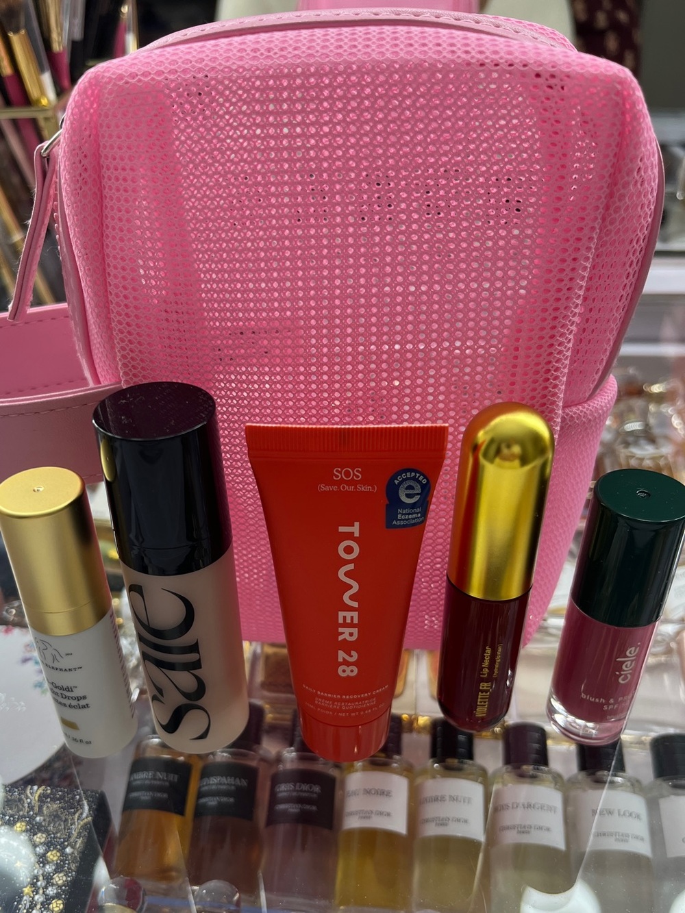 New without tags Sephora Mini Pink Mesh Cosmetic Bag with 5 minis beauty items.